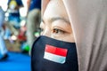 faces of young Indonesian women wearing masks to prevent the spread of covid-19