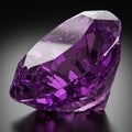Faceted purple gemstone, resembling an amethyst, with a vivid violet hue. The gem is Royalty Free Stock Photo