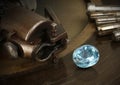 Faceting gemston, big diamond with jewelery equipment on background. Jewellery manufacture. Royalty Free Stock Photo