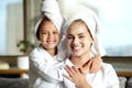 Facial, beauty and skincare at a spa for a bonding mother and daughter. Portrait of a cheerful, loving and joyful little Royalty Free Stock Photo