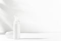 Facial, body care cosmetics bottle with dispenser. White unbranded flacon on light mockup. Blank package for nourishing or