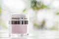 Facial and body cream on bokeh background
