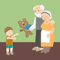 Grandfather and grandmother give a grandson a teddy bear.