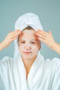 Facial care and beauty treatments. Beautiful woman with a sheet moisturizing mask on her face Royalty Free Stock Photo