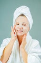 Facial care and beauty treatments. Beautiful woman with a sheet moisturizing mask on her face Royalty Free Stock Photo