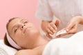 Facial care - woman cosmetics treatment in salon