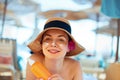 Facial Care. Young Female Holding Bottle Sun Cream and Applying on Face Smiling. Beauty Face. Royalty Free Stock Photo