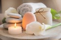 Facial cleansing brush and massager, towel and candle, sea stones, skin care beauty spa concept, soft focus background