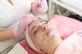 Facial cleansing procedures in a beauty salon. Skin care. Cleansing the face from comedones.