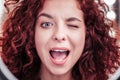 Nice happy red haired woman winking to you Royalty Free Stock Photo
