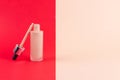 Facial foundation liquid cream for correction skin. Unbranded glass bottle with pipette on red beige background. Cosmetic product Royalty Free Stock Photo