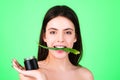 Facial green mask for beauty woman. Beautiful woman holding facial care with aloe vera. Beautician is making facial mask