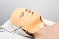 Facial mask electrophoresis procedure Royalty Free Stock Photo