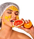 Facial mask from fruits for woman. Girl in medical hat. Royalty Free Stock Photo