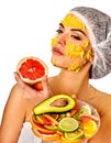 Facial mask from fruits for woman. Girl in medical hat. Royalty Free Stock Photo