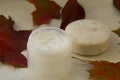 Mask in a jar and a soap in autumn leaves Royalty Free Stock Photo