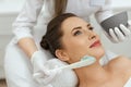 Facial Mask. Woman Applying Cosmetic Alginate Mask On Skin