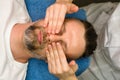 Facial massage for man Royalty Free Stock Photo