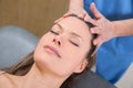 Facial massage relaxing theraphy on woman face