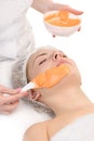 Facial orange alginate mask applying