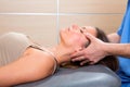 Facial reflexology doctor hands in woman face