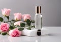 Facial serum in glass dropper bottle on white podium and pink roses on grey background. Natural skin care cosmetic. Beauty routine Royalty Free Stock Photo