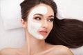 Facial Skin Care. Beautiful Woman Getting Cosmetic Mask In Salon Royalty Free Stock Photo