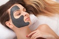 Facial Skin Care. Beautiful Woman Getting Cosmetic Mask In Salon Royalty Free Stock Photo