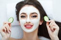 Facial Skin Care. Beautiful Woman Getting Cosmetic Mask In Salon Royalty Free Stock Photo