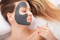 Facial Skin Care. Beautiful Woman Getting Cosmetic Mask In Salon Royalty Free Stock Photo