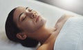 Facials cleanse, exfoliate and nourishes the skin. a young woman getting a facial treatment at a spa.