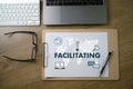 FACILITATING on table Facilitation secrets Royalty Free Stock Photo