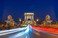Facing Chain bridge at night with car light trails  in Budapest Hungary Royalty Free Stock Photo
