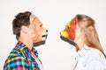 Facing off with animalistic intent. Young hipster couple facing each other while wearing animal masks.