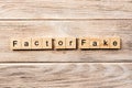 Fact or fake word written on wood block. fact or fake text on table, concept Royalty Free Stock Photo
