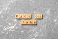 Fact or fake word written on wood block. fact or fake text on table, concept Royalty Free Stock Photo