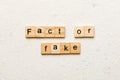 fact or fake word written on wood block. fact or fake text on table, concept Royalty Free Stock Photo