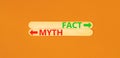 Fact or myth symbol. Concept word Myth and Fact on beautiful wooden stick. Beautiful orange table orange background. Business and Royalty Free Stock Photo