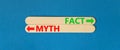 Fact or myth symbol. Concept word Myth and Fact on beautiful wooden stick. Beautiful blue table blue background. Business and fact Royalty Free Stock Photo