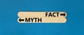 Fact or myth symbol. Concept word Myth and Fact on beautiful wooden stick. Beautiful blue table blue background. Business and fact Royalty Free Stock Photo