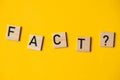 fact with a question on a yellow background Royalty Free Stock Photo