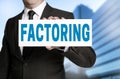 Factoring sign is held by businessman