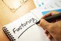 Factoring written by hand. Royalty Free Stock Photo