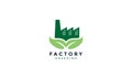 Factory  building industry with leaf green plant nature logo vector icon design Royalty Free Stock Photo