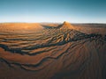 Factory Butte in the Caineville Badlands of Utah. Aerial drone panorama during sunrise. Royalty Free Stock Photo