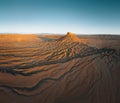 Factory Butte in the Caineville Badlands of Utah. Aerial drone panorama during sunrise. Royalty Free Stock Photo