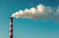 Factory chimney with smoke against sky. Air pollution issues. Steam from industrial stack. Ecology problems. Climate changes and Royalty Free Stock Photo