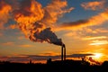Factory chimneys smoke industrial building silhouette over Beautiful sunset Royalty Free Stock Photo