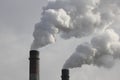 Factory chimneys smoking with dense white smoke. Industrial pollution of air, electric plant emission,  environment ecology proble Royalty Free Stock Photo