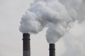 Factory chimneys smoking with dense white smoke. Industrial pollution of air, electric plant emission,  environment ecology proble Royalty Free Stock Photo